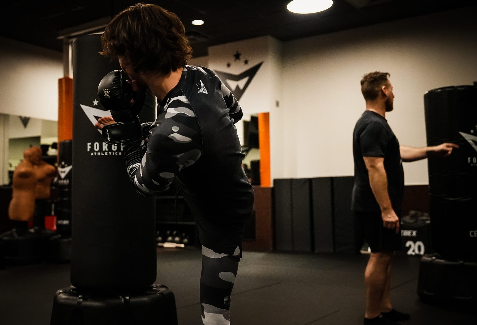 A member trains striking during a men's personal training session at Forge Athletics