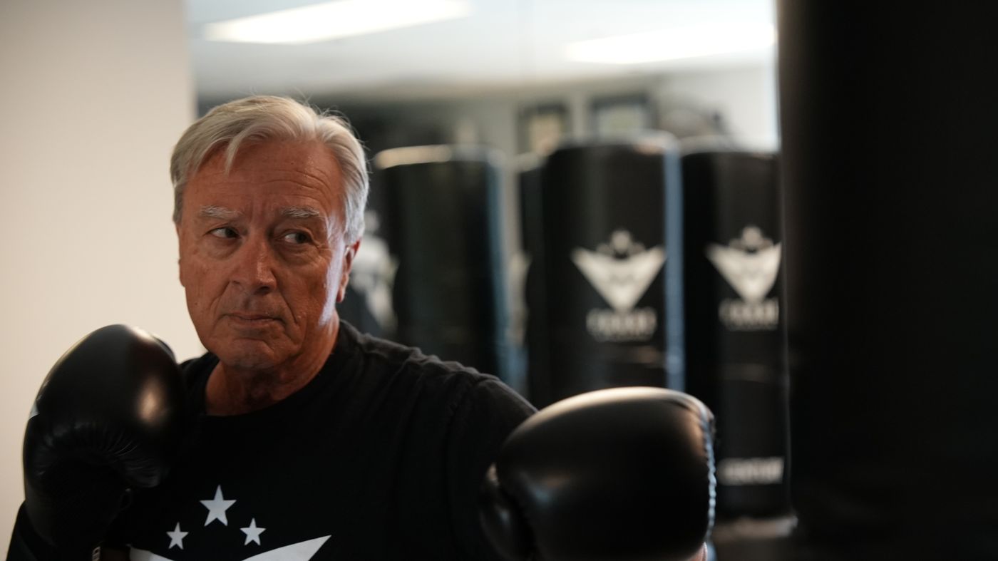 A senior member sets his guard in boxing gloves during Senior Personal Training at Forge Athletics