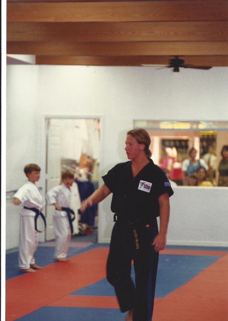 Sixteen-year-old Wil Pino teaching a kids martial arts class at his first Coastland Center dojo