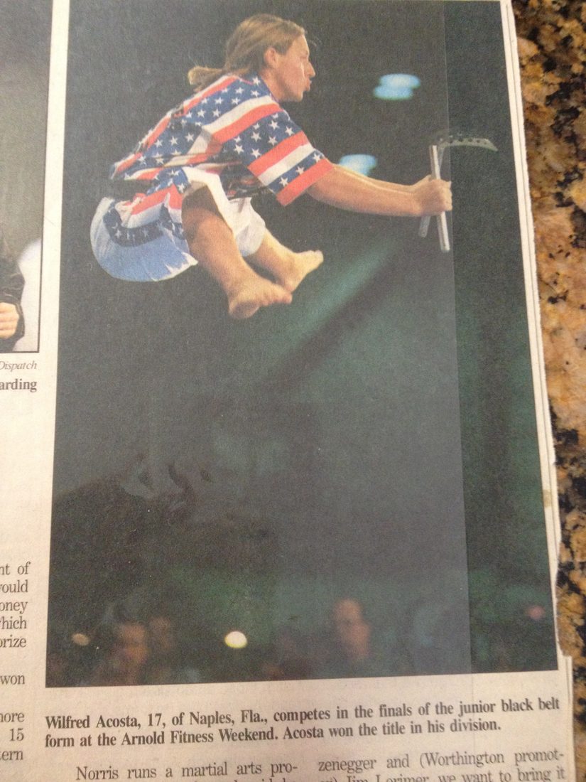 Columbus Dispatch newspaper page showing Wil Pino's flying split kick at the Arnold Classic