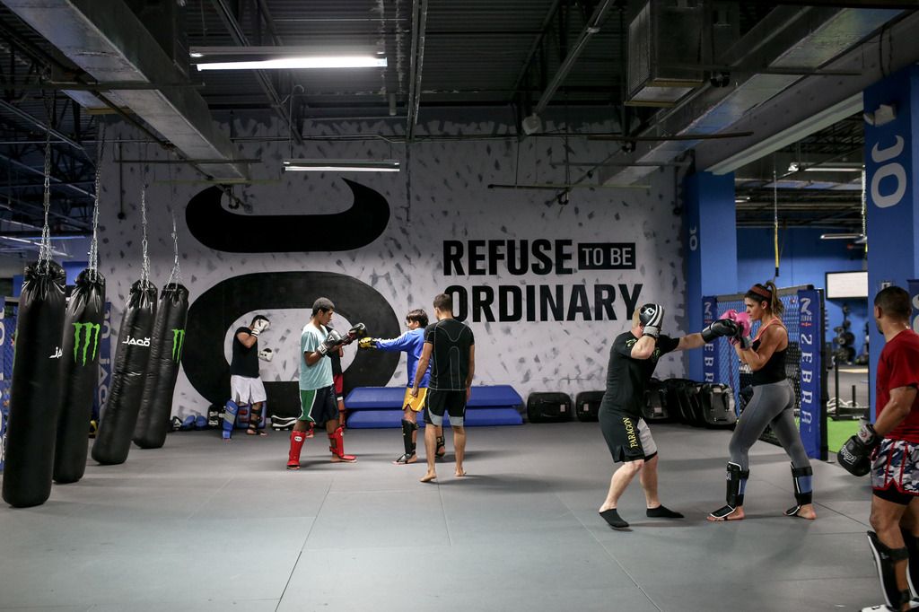 The Jaco Athletic Club striking floor with heavy bags during a training session