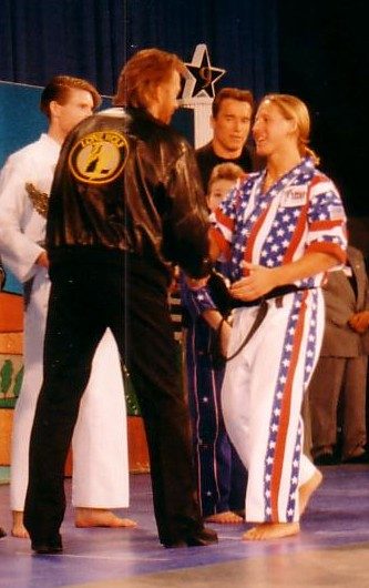 Chuck Norris congratulating Wil Pino on his Arnold Classic victory in 1997