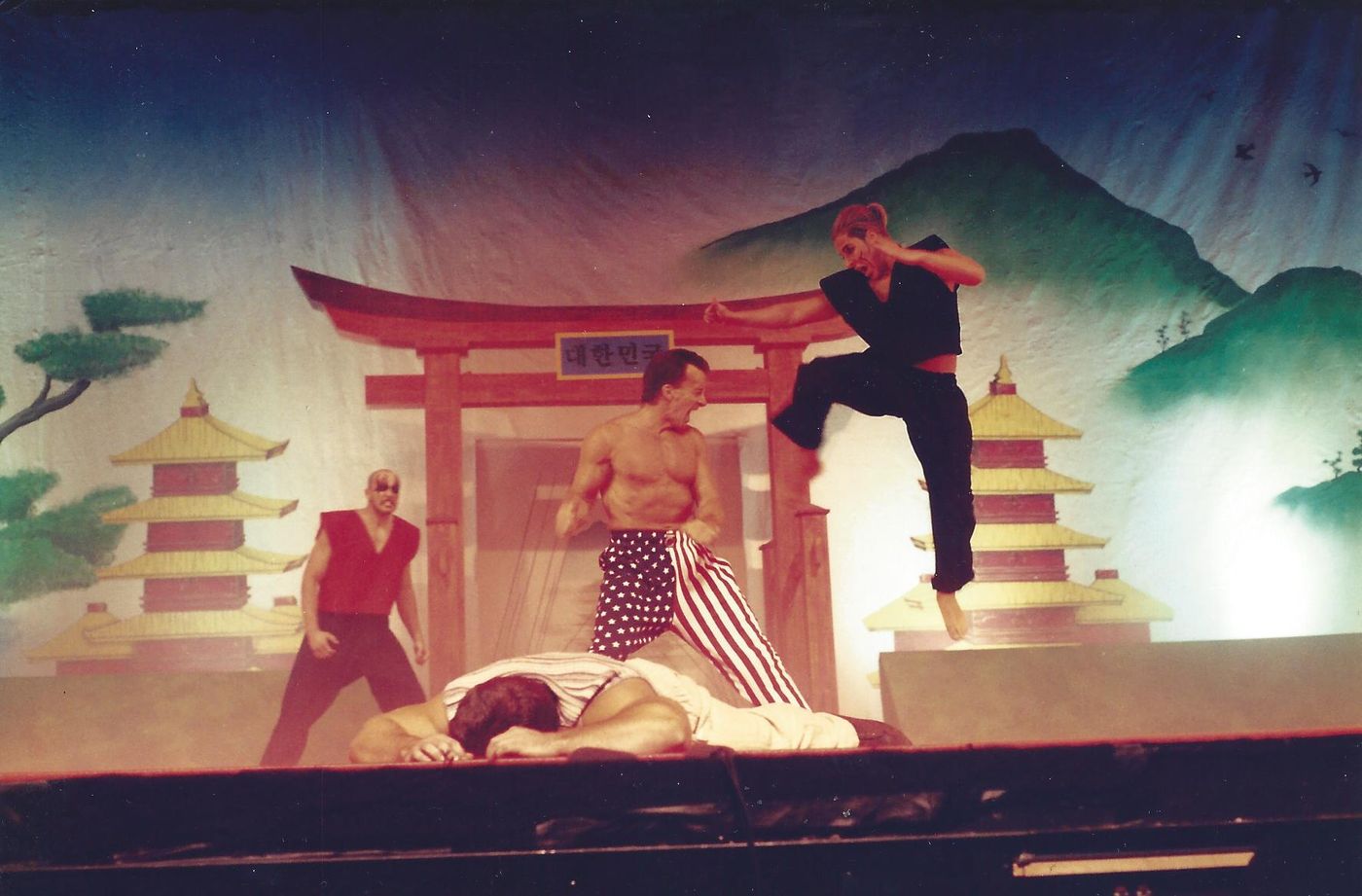 Wil Pino performing in a martial arts stage show opening ceremony in 1996