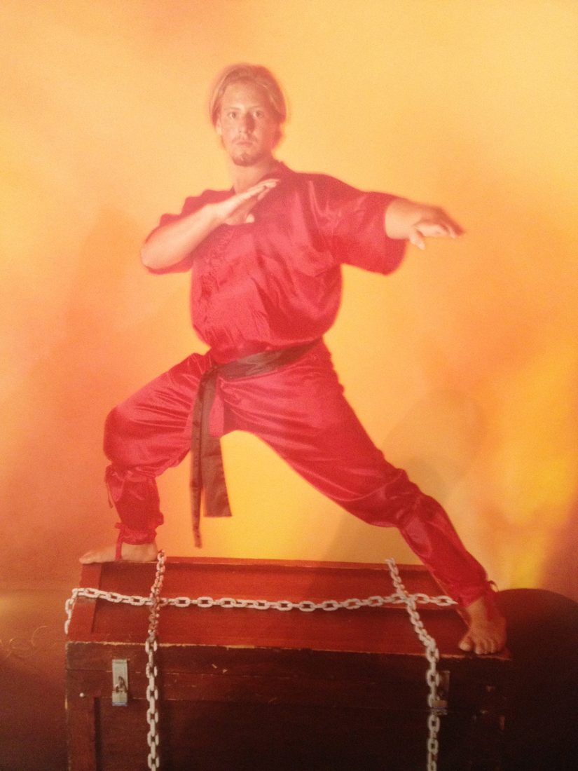 Wil Pino performing in a martial arts stage and stunt show in 1998