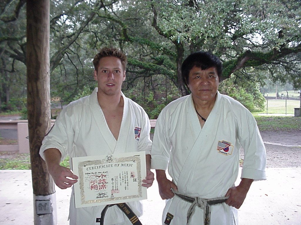 Wil Pino holding his third-dan Shorin-Ryu certificate beside the Okinawan legend Tadashi Yamashita